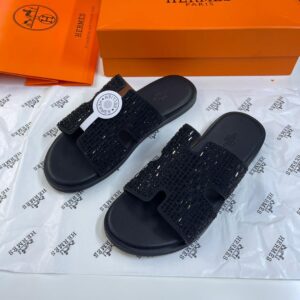 Stylish black beaded slide sandals with open design, perfect for summer or casual wear. Ideal for fashion-forward individuals seeking versatile footwear.