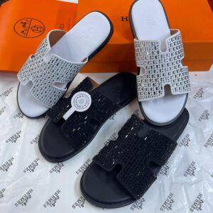 Stylish black beaded slide sandals with open design, perfect for summer or casual wear. Ideal for fashion-forward individuals seeking versatile footwear.
