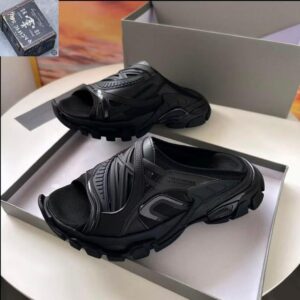 A pair of black BALENCIAGA sport sandals displayed in a shoe box, perfect for men seeking stylish and comfortable footwear.