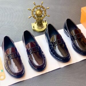 Luxury black leather loafers for men, high-class penny loafers, formal shoes for elite individuals.